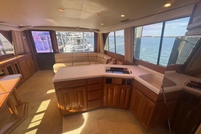  Yacht Photos Pics Interior of 1996 Viking 50 Sport Fisher yacht with spacious seating and ocean view.