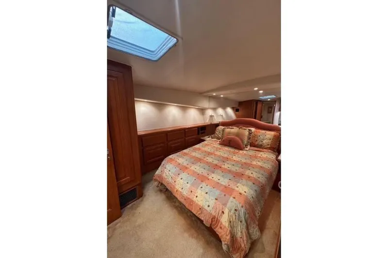  Yacht Photos Pics Luxurious bedroom interior of 1996 Viking 50 Sport Fisher Convertible yacht.