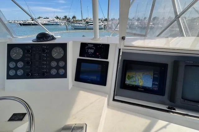  Yacht Photos Pics 1996 Viking 50 Sport Fisher Convertible helm with navigation instruments and ocean view.