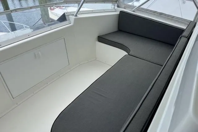  Yacht Photos Pics 1996 Viking 50 Sport Fisher Convertible boat interior with cushioned seating area.