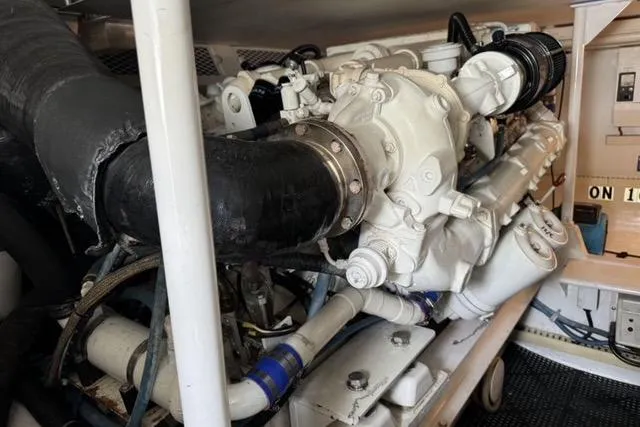  Yacht Photos Pics Engine room of 1996 Viking 50 Sport Fisher Convertible boat, showcasing mechanical components.