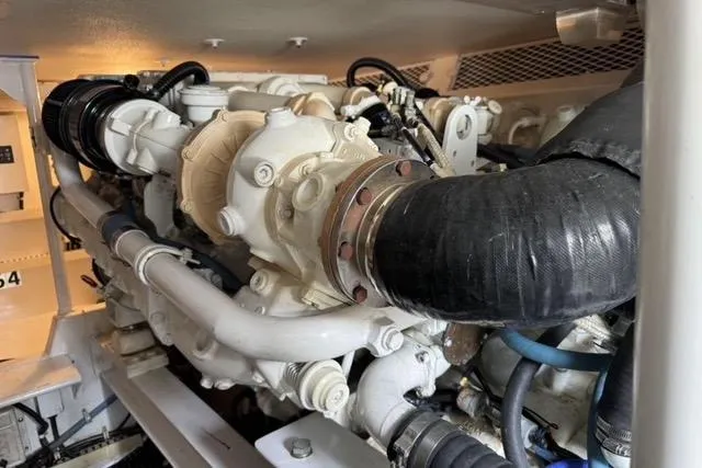  Yacht Photos Pics Engine room of 1996 Viking 50 Sport Fisher Convertible boat, showcasing detailed machinery.