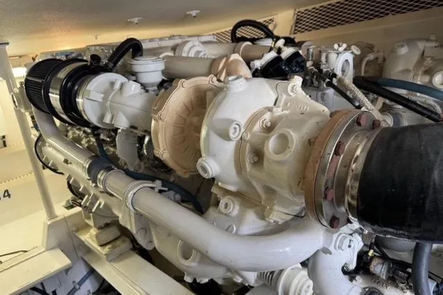  Yacht Photos Pics Engine room of a 1996 Viking 50 Sport Fisher Convertible boat, showcasing detailed machinery.