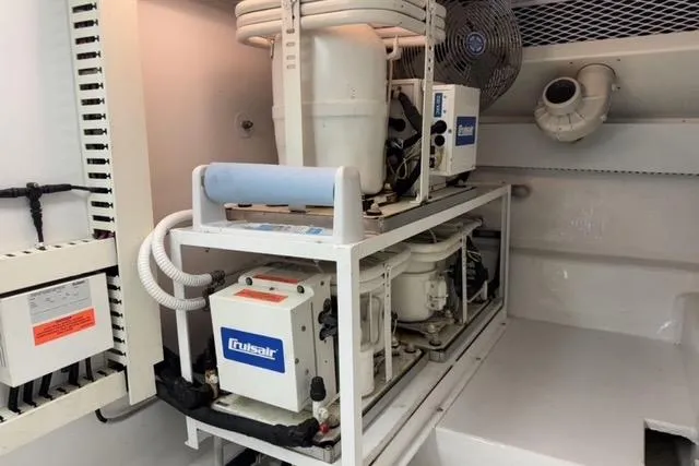  Yacht Photos Pics Engine room of 1996 Viking 50 Sport Fisher with Cruisair system.