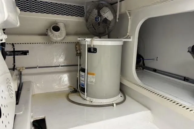  Yacht Photos Pics Engine room of 1996 Viking 50 Sport Fisher with fan and equipment.