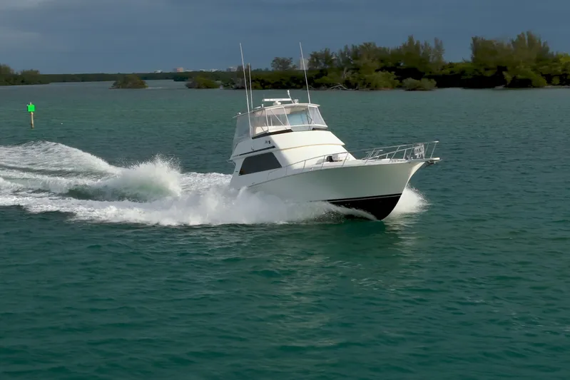  Yacht Photos Pics 1996 Viking 50 Sport Fisher Convertible cruising on open water.
