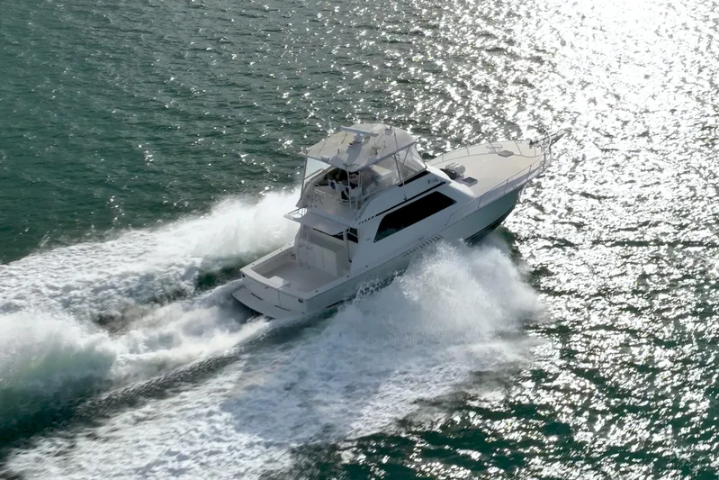  Yacht Photos Pics Aerial view of 1996 Viking 50 Sport Fisher yacht cruising on open water.