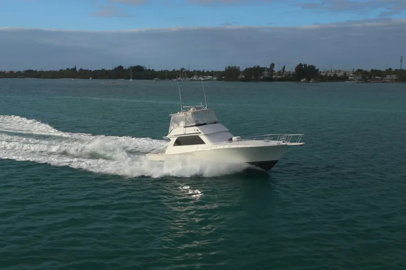  Yacht Photos Pics 1996 Viking 50 Sport Fisher Convertible cruising on open water.