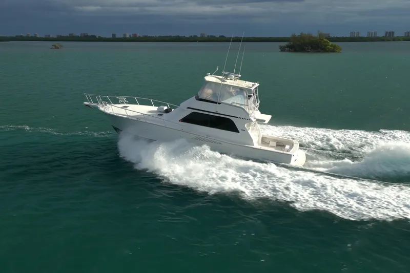  Yacht Photos Pics 1996 Viking 50 Sport Fisher Convertible cruising on open water.