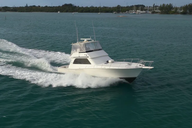  Yacht Photos Pics 1996 Viking 50 Sport Fisher Convertible cruising on open water.