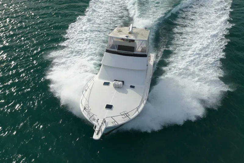  Yacht Photos Pics 1996 Viking 50 Sport Fisher Convertible cruising on open water, aerial view.