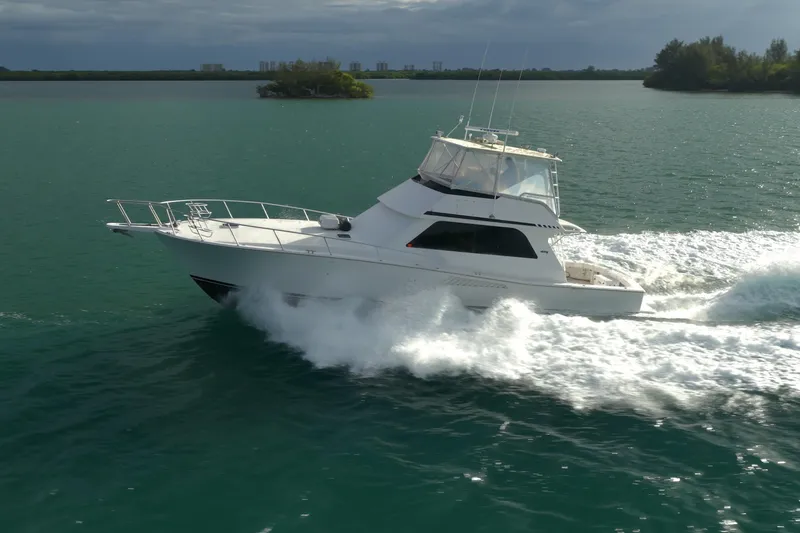  Yacht Photos Pics 1996 Viking 50 Sport Fisher Convertible cruising on open water.