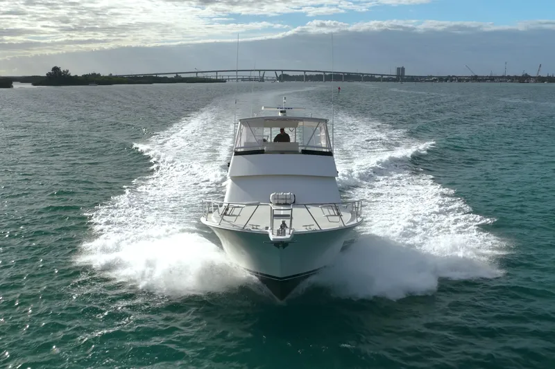  Yacht Photos Pics 1996 Viking 50 Sport Fisher Convertible cruising on open water, creating a wake.