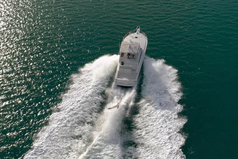  Yacht Photos Pics Aerial view of 1996 Viking 50 Sport Fisher cruising on open water.