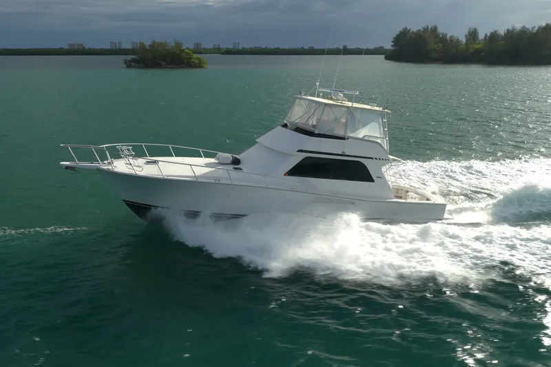  Yacht Photos Pics 1996 Viking 50 Sport Fisher Convertible cruising on open water.