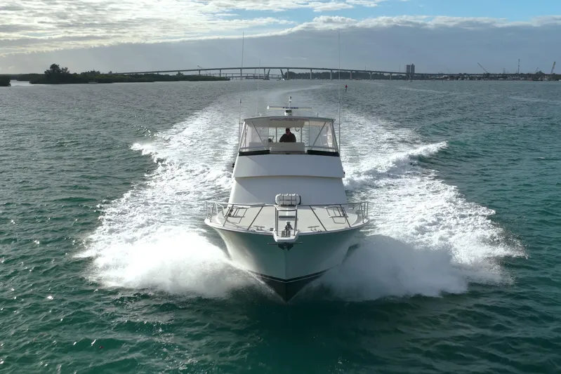  Yacht Photos Pics 1996 Viking 50 Sport Fisher Convertible cruising on open water, creating a dynamic wake.