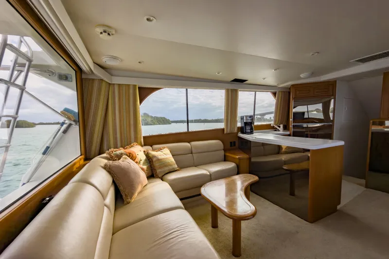  Yacht Photos Pics Luxurious interior of 1996 Viking 50 Sport Fisher yacht with plush seating and scenic views.