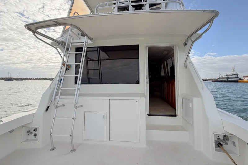  Yacht Photos Pics 1996 Viking 50 Sport Fisher Convertible boat with ladder and open cabin door.