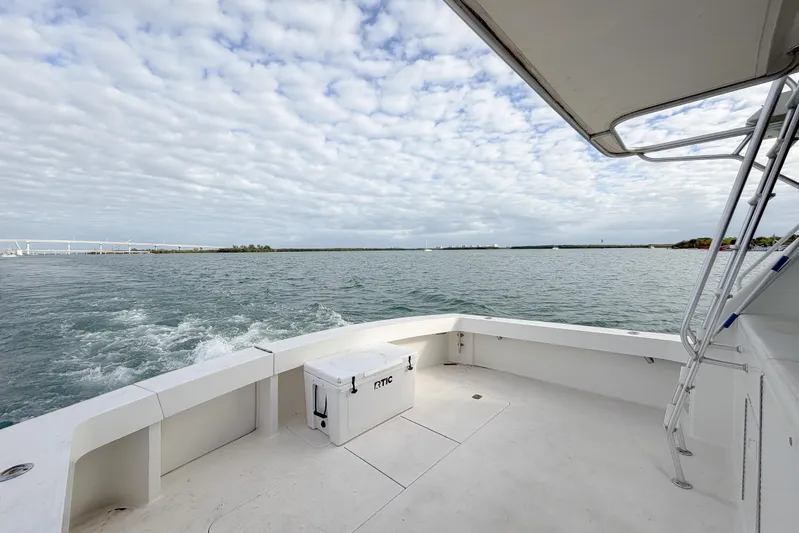  Yacht Photos Pics 1996 Viking 50 Sport Fisher Convertible boat on open water under cloudy sky.