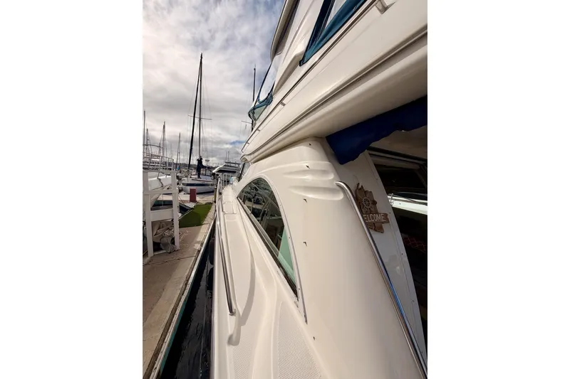 Spirit Of St Louis Yacht Photos Pics 2001 Maxum 4600 SCB Limited Edition yacht docked at marina under cloudy sky.