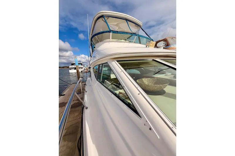 Spirit Of St Louis Yacht Photos Pics 2001 Maxum 4600 SCB Limited Edition yacht docked under a blue sky.