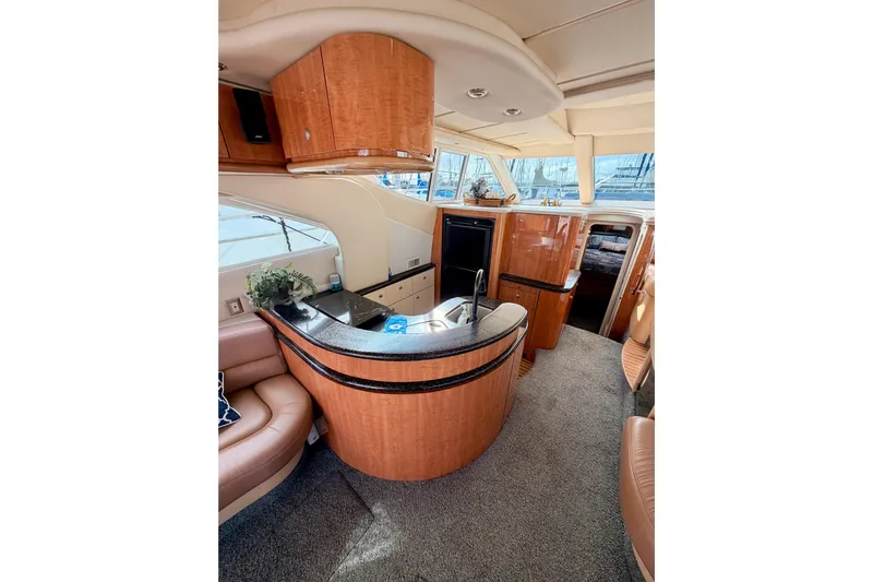 Spirit Of St Louis Yacht Photos Pics Luxurious interior of 2001 Maxum 4600 SCB yacht with modern kitchen and seating area.