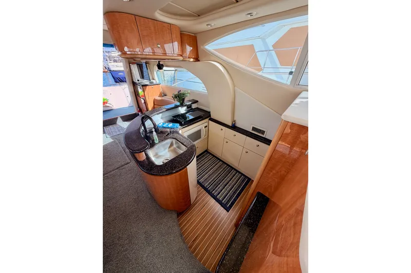 Spirit Of St Louis Yacht Photos Pics Luxurious interior of 2001 Maxum 4600 SCB Limited Edition yacht with modern kitchen amenities.