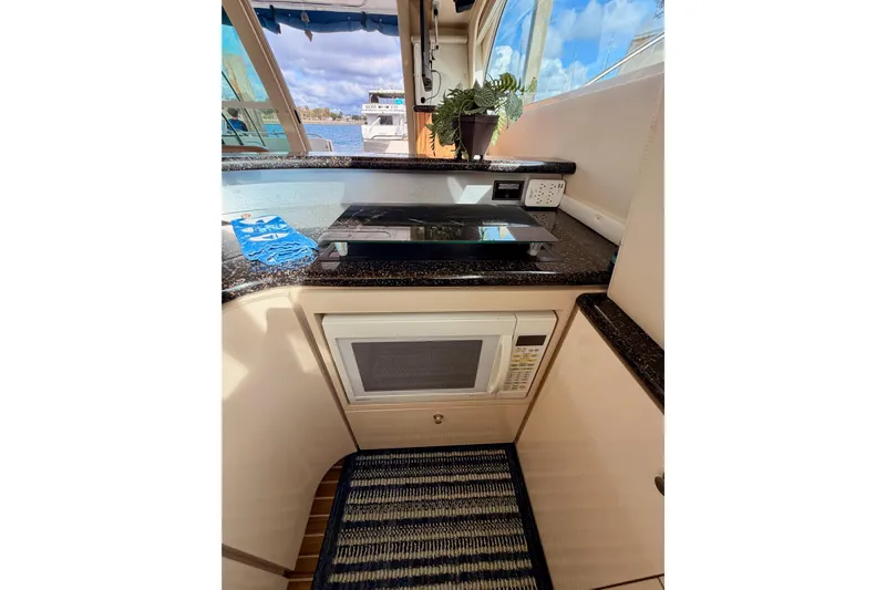 Spirit Of St Louis Yacht Photos Pics 2001 Maxum 4600 SCB Limited Edition yacht kitchen with microwave and cooktop.