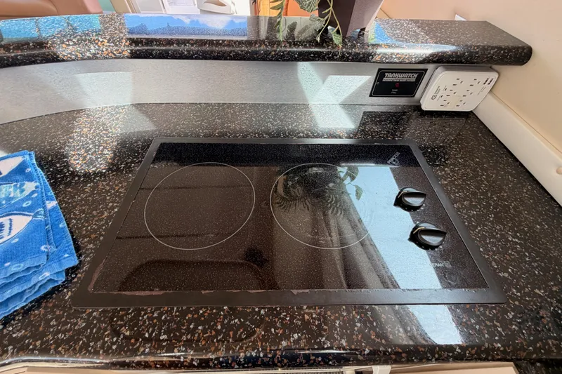 Spirit Of St Louis Yacht Photos Pics 2001 Maxum 4600 SCB Limited Edition yacht kitchen with sleek black cooktop.