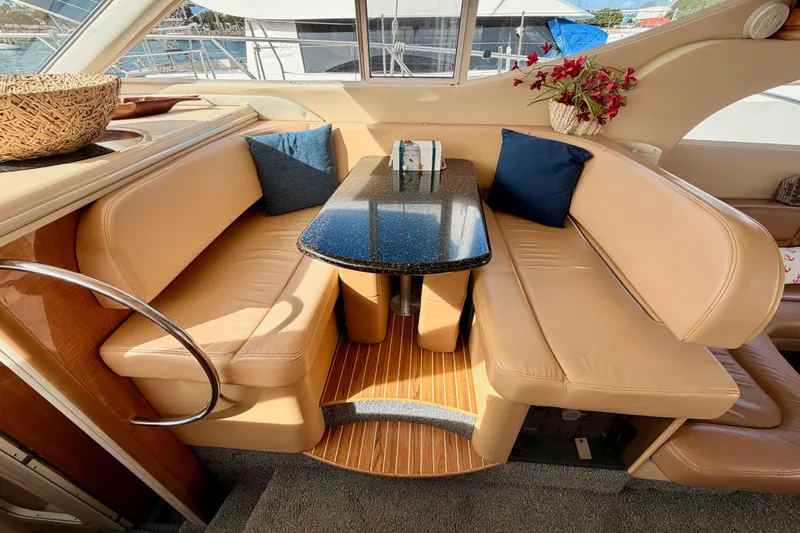 Spirit Of St Louis Yacht Photos Pics Luxurious interior of 2001 Maxum 4600 SCB yacht with leather seating and elegant table.