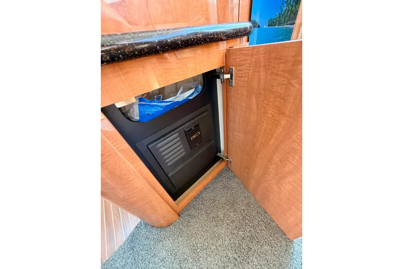 Spirit Of St Louis Yacht Photos Pics Open cabinet in 2001 Maxum 4600 SCB Limited Edition yacht, revealing interior storage space.