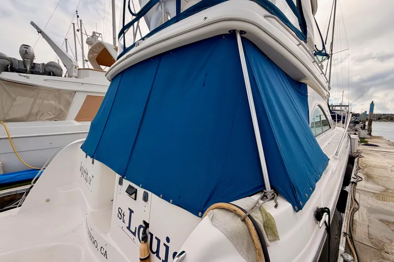 Spirit Of St Louis Yacht Photos Pics 2001 Maxum 4600 SCB Limited Edition yacht docked with blue canopy.