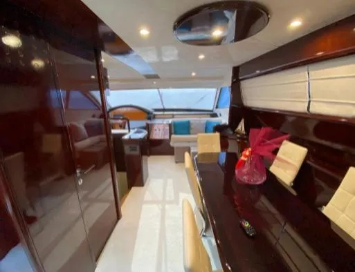  Yacht Photos Pics Luxurious interior of a 2002 Ferretti Yachts 72, featuring elegant seating and dining area.
