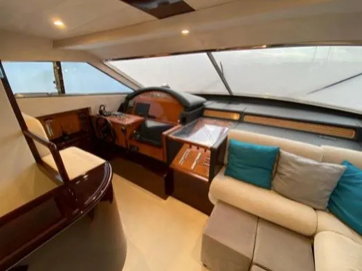  Yacht Photos Pics Luxurious interior of a 2002 Ferretti Yachts 72, featuring helm and plush seating.