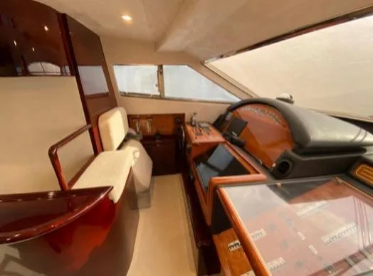 Yacht Photos Pics Interior helm of 2002 Ferretti Yachts 72, featuring luxurious wood and leather finishes.