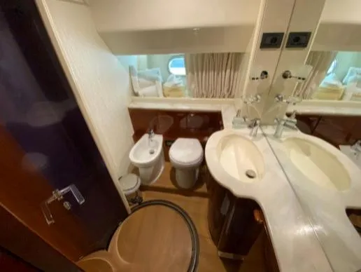  Yacht Photos Pics Luxurious bathroom in 2002 Ferretti Yachts 72, featuring elegant fixtures and a modern design.
