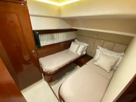  Yacht Photos Pics Twin cabin interior of 2002 Ferretti Yachts 72, featuring elegant wood finishes.