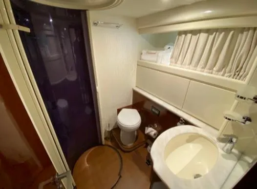  Yacht Photos Pics Luxurious bathroom in a 2002 Ferretti Yachts 72, featuring modern fixtures and elegant design.