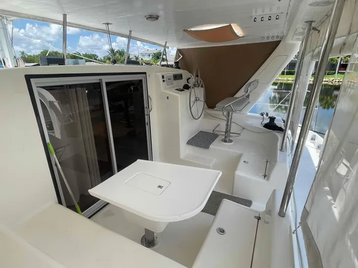 Endless Summer Yacht Photos Pics Spacious deck of 2008 Admiral Executive yacht with seating and helm station.