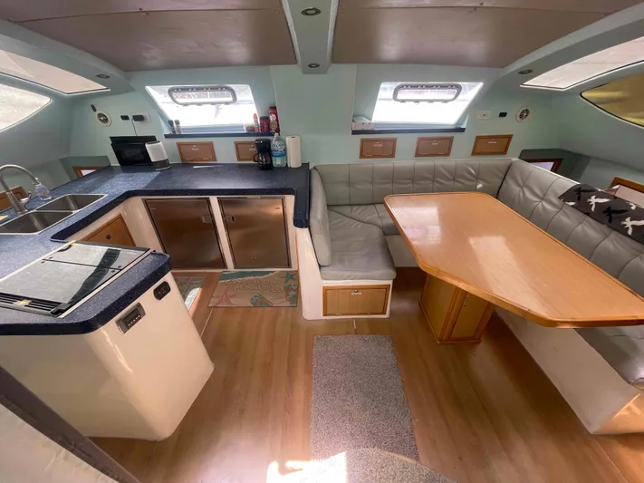 Endless Summer Yacht Photos Pics Luxurious 2008 Admiral Executive yacht interior with kitchen and dining area.