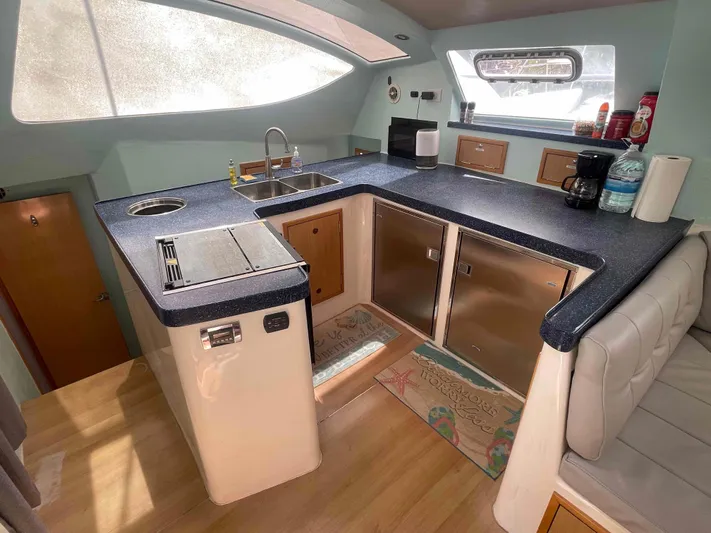 Endless Summer Yacht Photos Pics Modern kitchen in 2008 Admiral Executive yacht with sleek countertops and appliances.