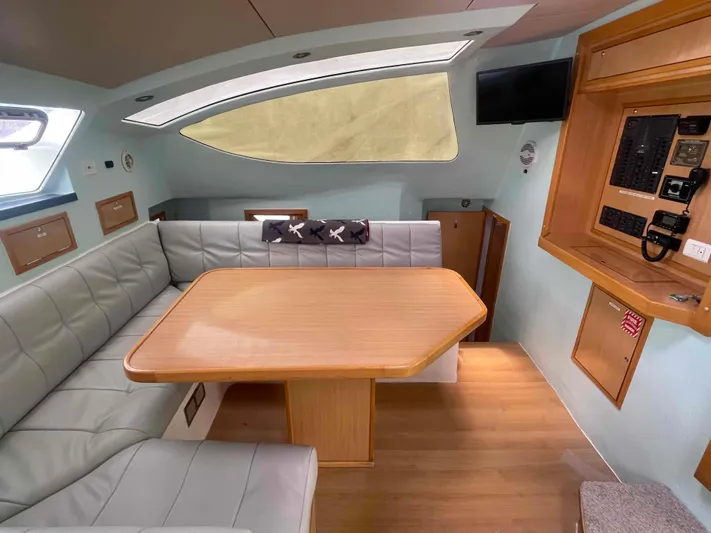 Endless Summer Yacht Photos Pics Luxurious 2008 Admiral Executive yacht interior with dining area and control panel.