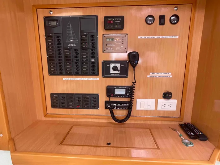 Endless Summer Yacht Photos Pics Control panel of a 2008 Admiral Executive yacht with switches and communication devices.