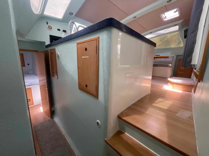 Endless Summer Yacht Photos Pics Interior of a 2008 Admiral Executive yacht, featuring wood accents and natural light.