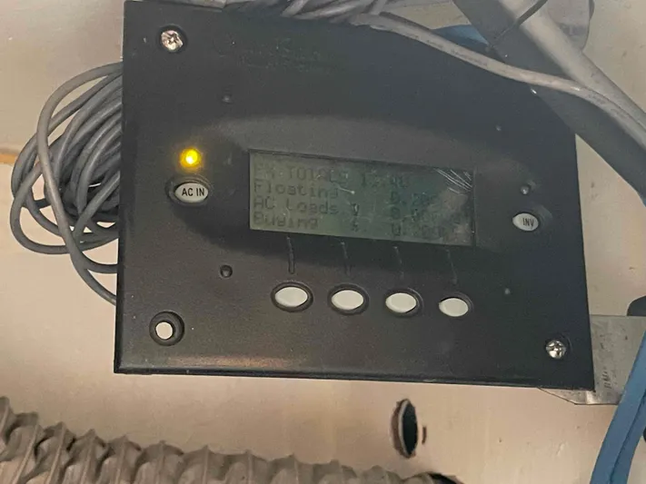 Endless Summer Yacht Photos Pics Control panel of a 2008 Admiral Executive with display and buttons, showing AC input status.