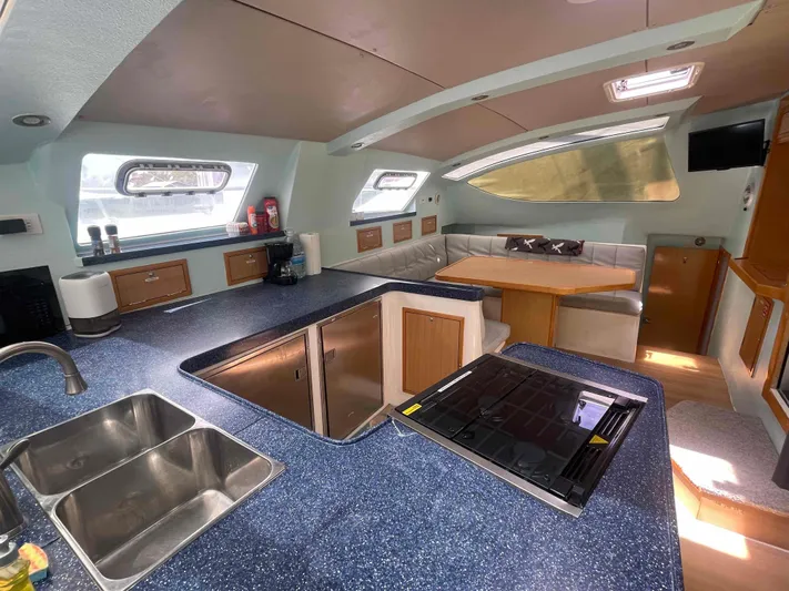 Endless Summer Yacht Photos Pics Luxurious 2008 Admiral Executive yacht interior with modern kitchen and cozy seating area.