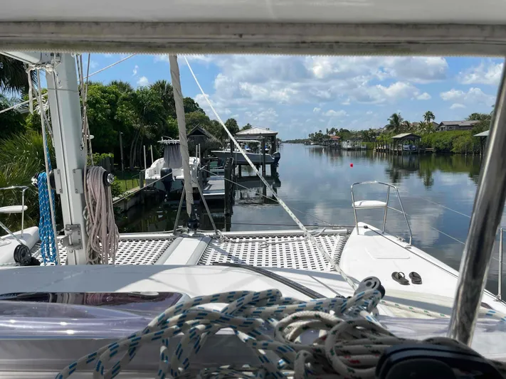 Endless Summer Yacht Photos Pics View from 2008 Admiral Executive yacht, docked in a serene, palm-lined canal.