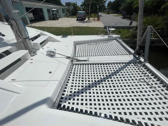 Endless Summer Yacht Photos Pics Deck of 2008 Admiral Executive catamaran with netting and dockside view.