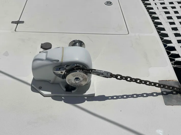 Endless Summer Yacht Photos Pics Anchor windlass on 2008 Admiral Executive boat deck, with chain and netting visible.