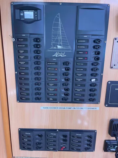 Endless Summer Yacht Photos Pics Electrical control panel of a 2008 Admiral Executive yacht with labeled switches and systems monitor.